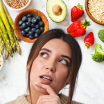 Woman considering foods to boost progesterone.